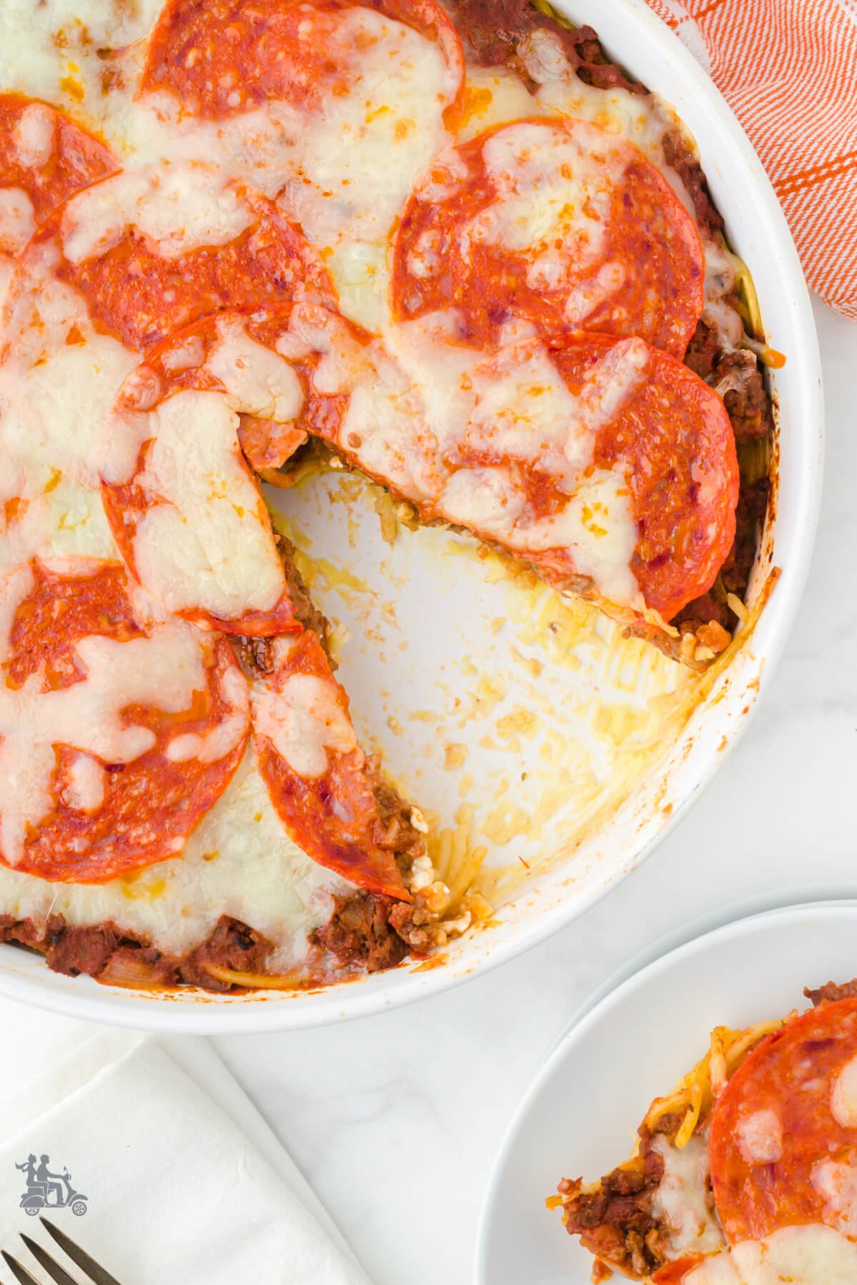 Overhead view of the spaghetti pie in a white pie dish. 