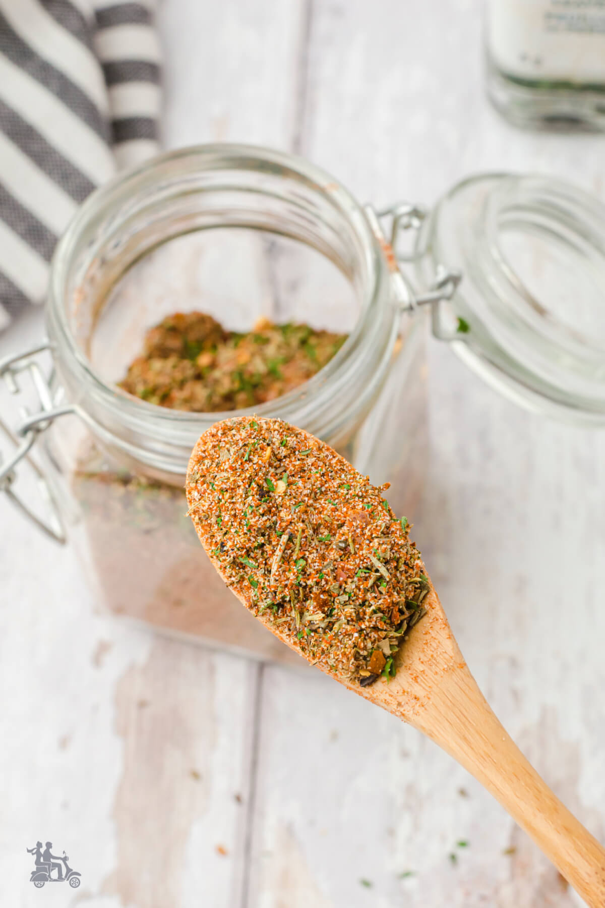 A closeup of the Tuscan seasoning blend in a wooden spoon. 