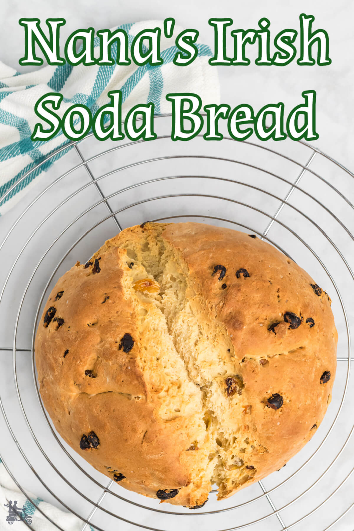 Large loaf of Irish Soda bread on round cooling rack.