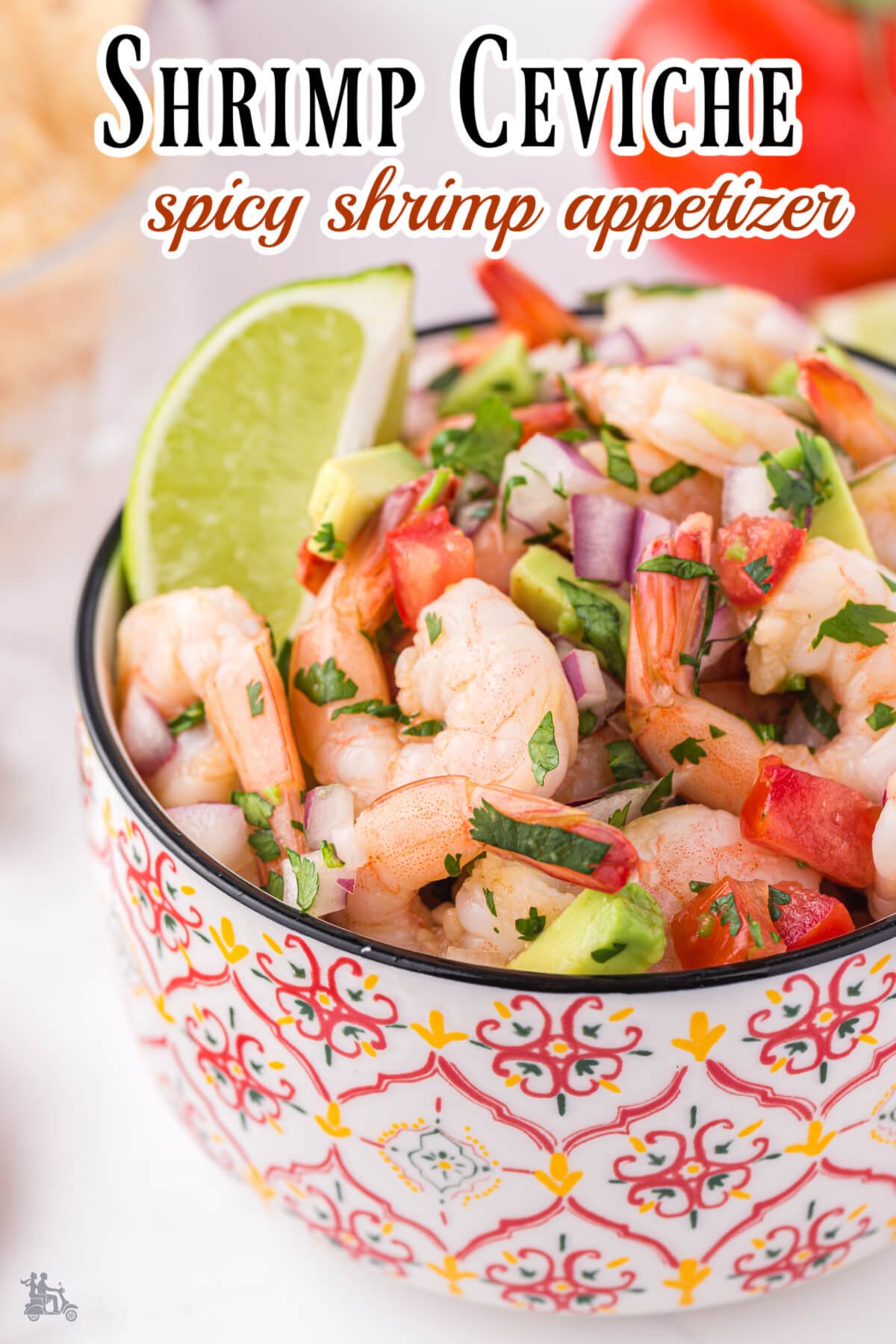 A red print bowl filled with shrimp ceviche appetizer. 