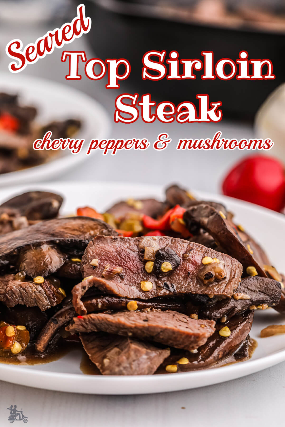 Serving of Sliced steak with peppers and mushrooms.