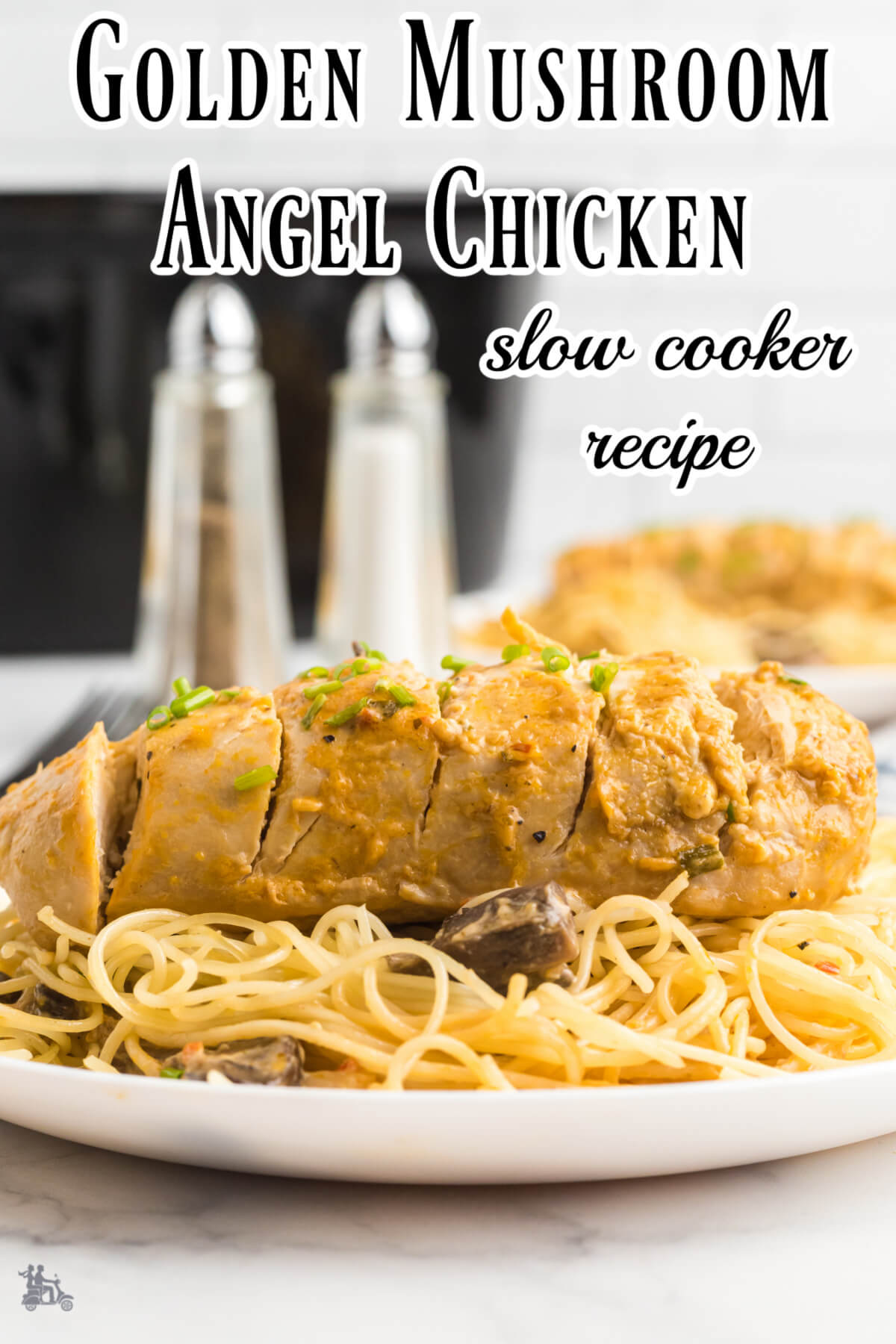 Side view of the angel chicken breast on a bed of angel hair pasta. 