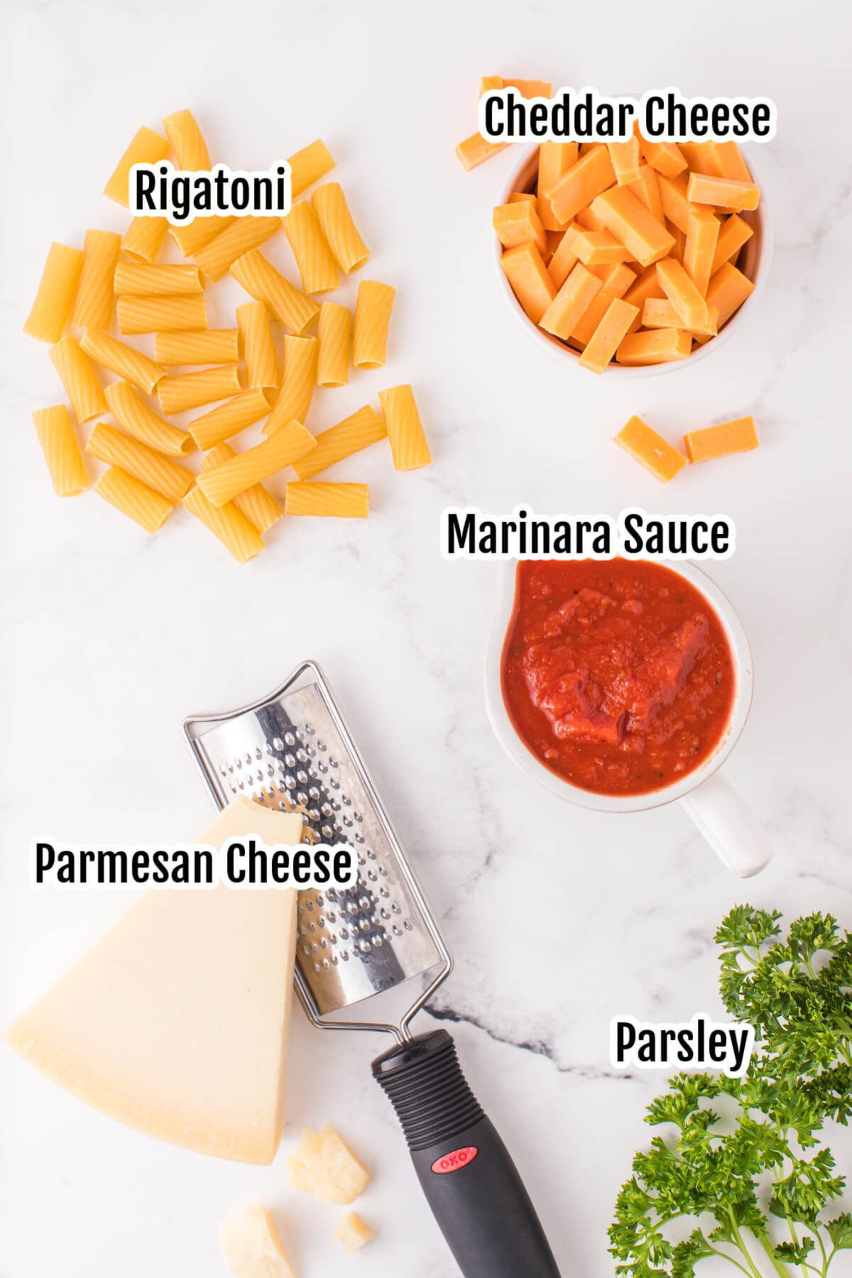 Image of ingredients needed for baked rigatoni. 