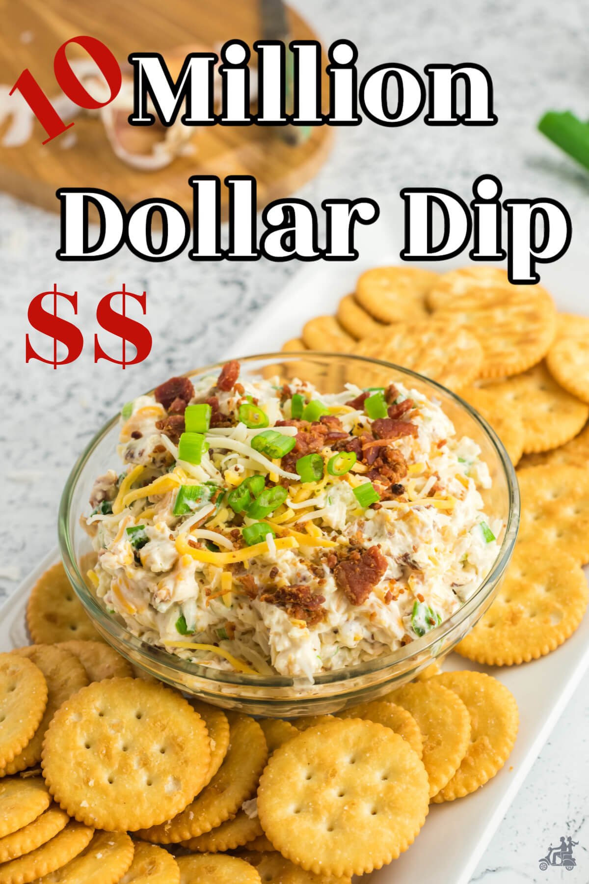 A bowl of the Neiman Marcus Dip with Ritz crackers on a rectangular platter. 