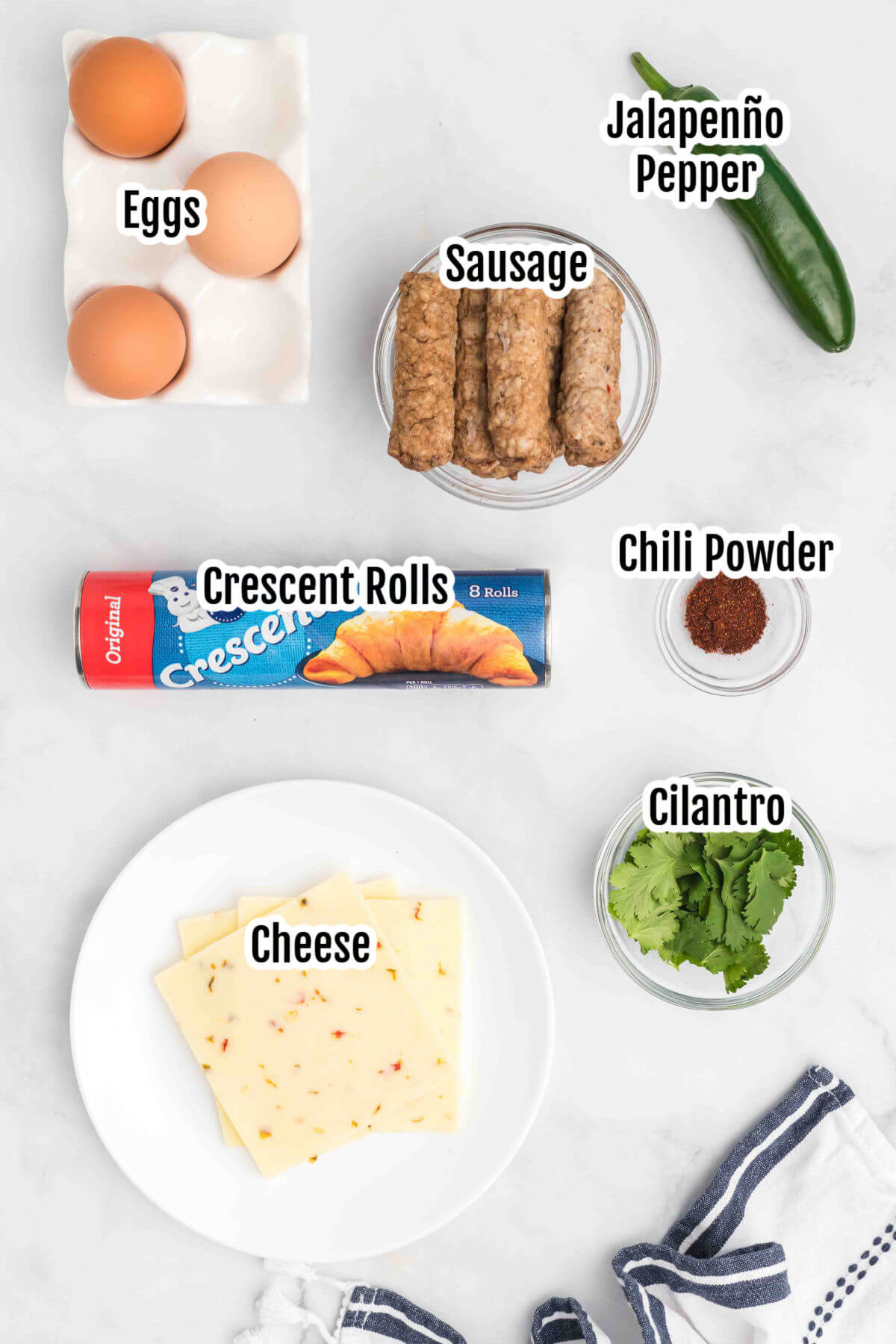 Image of the ingredients for Sausage Crescent Roll Ups. 