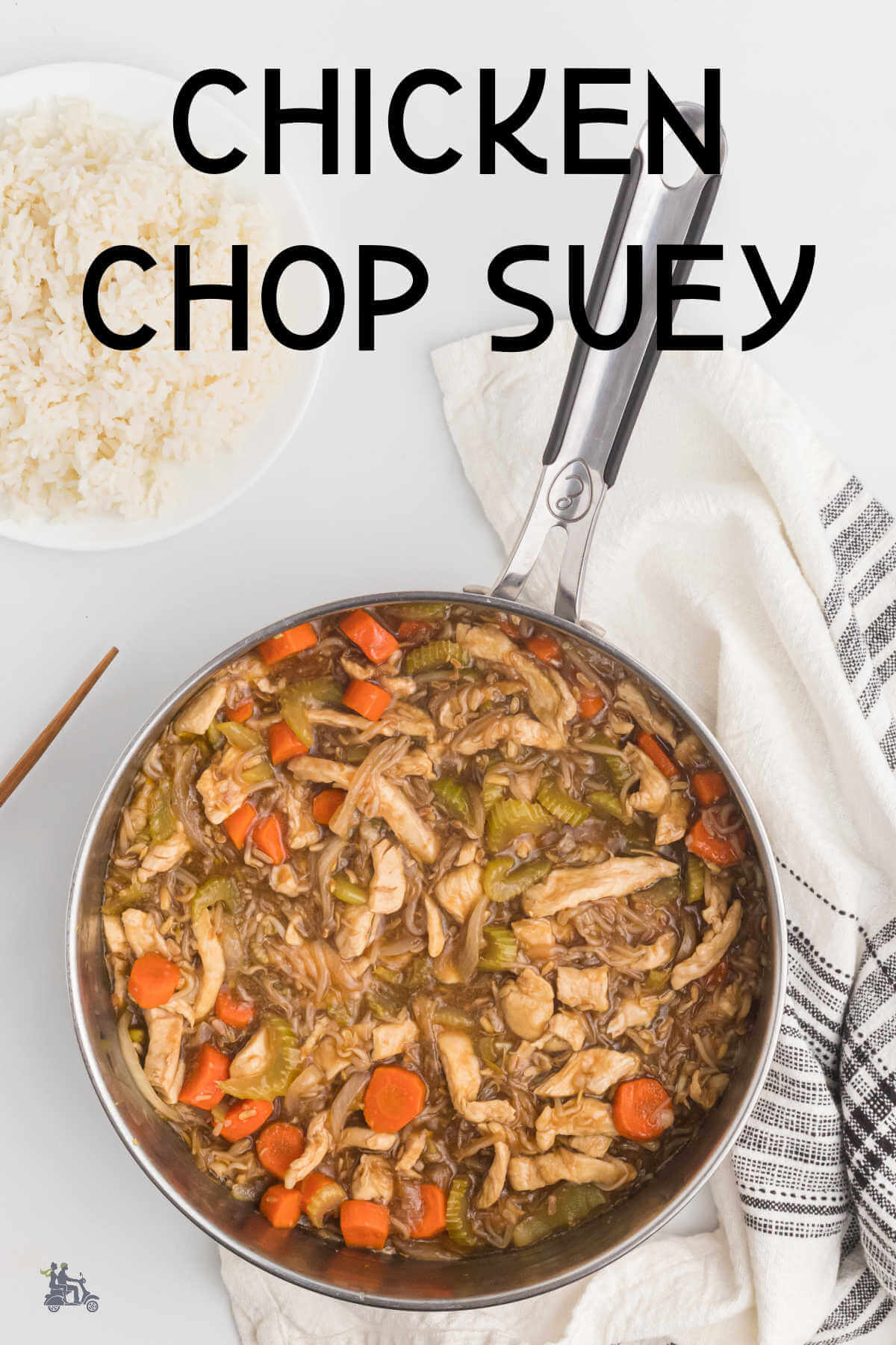 A skillet with a recipe of chicken chop suey cooked with rice on the side. 