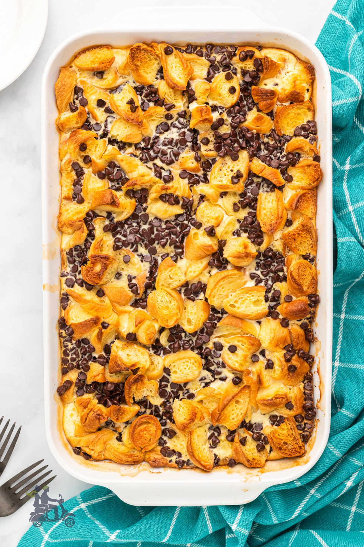 Chocolate Croissant Breakfast Bake golden brown and dotted with chocolate chips. 