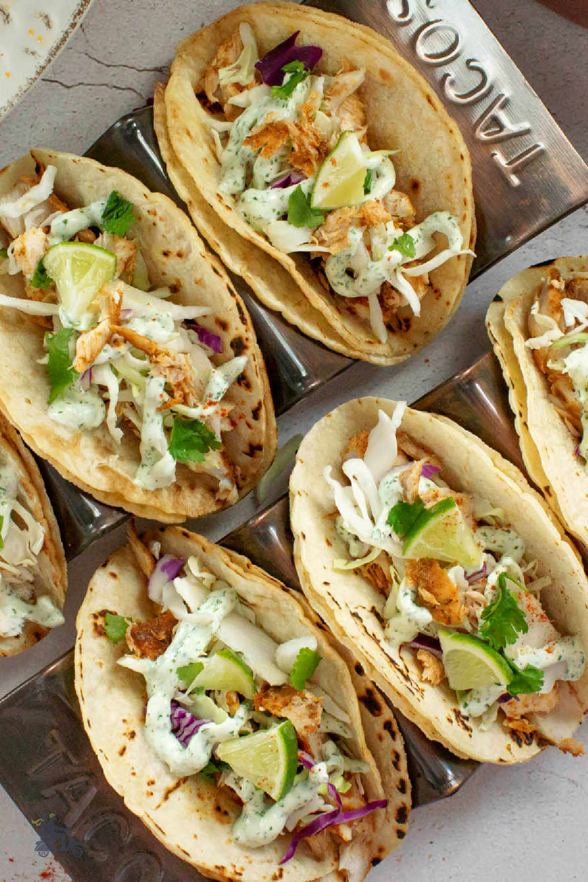 Mahi-Mahi Tacos with cabbage slaw and topped with Cilantro lime sauce.