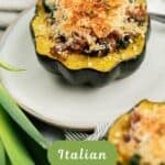 An Acorn Squash half stuffed with an Italian sausage, mushroom, spinach filling and topped with a golden Panko cheese crust.
