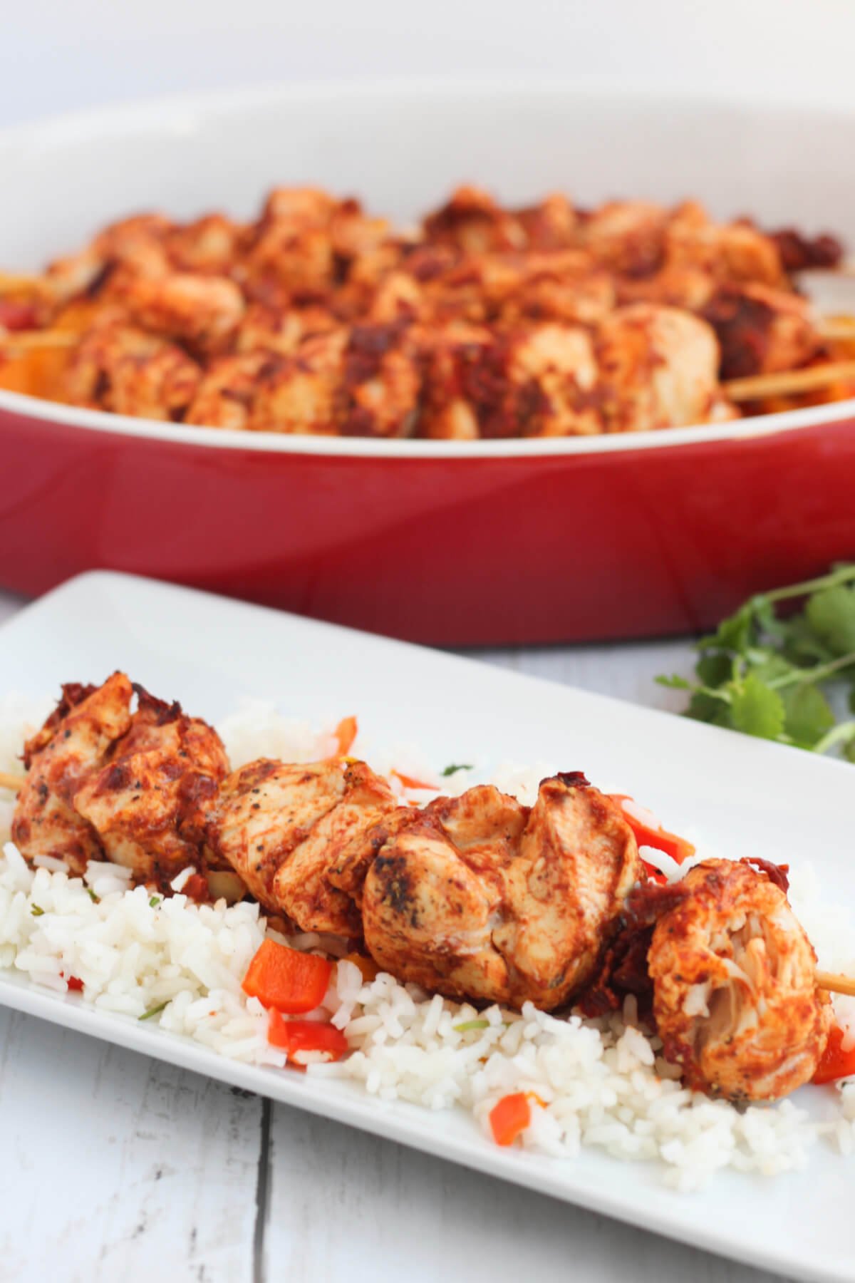 Chipotle chicken kebabs baked in the oven and served on bed of rice. 