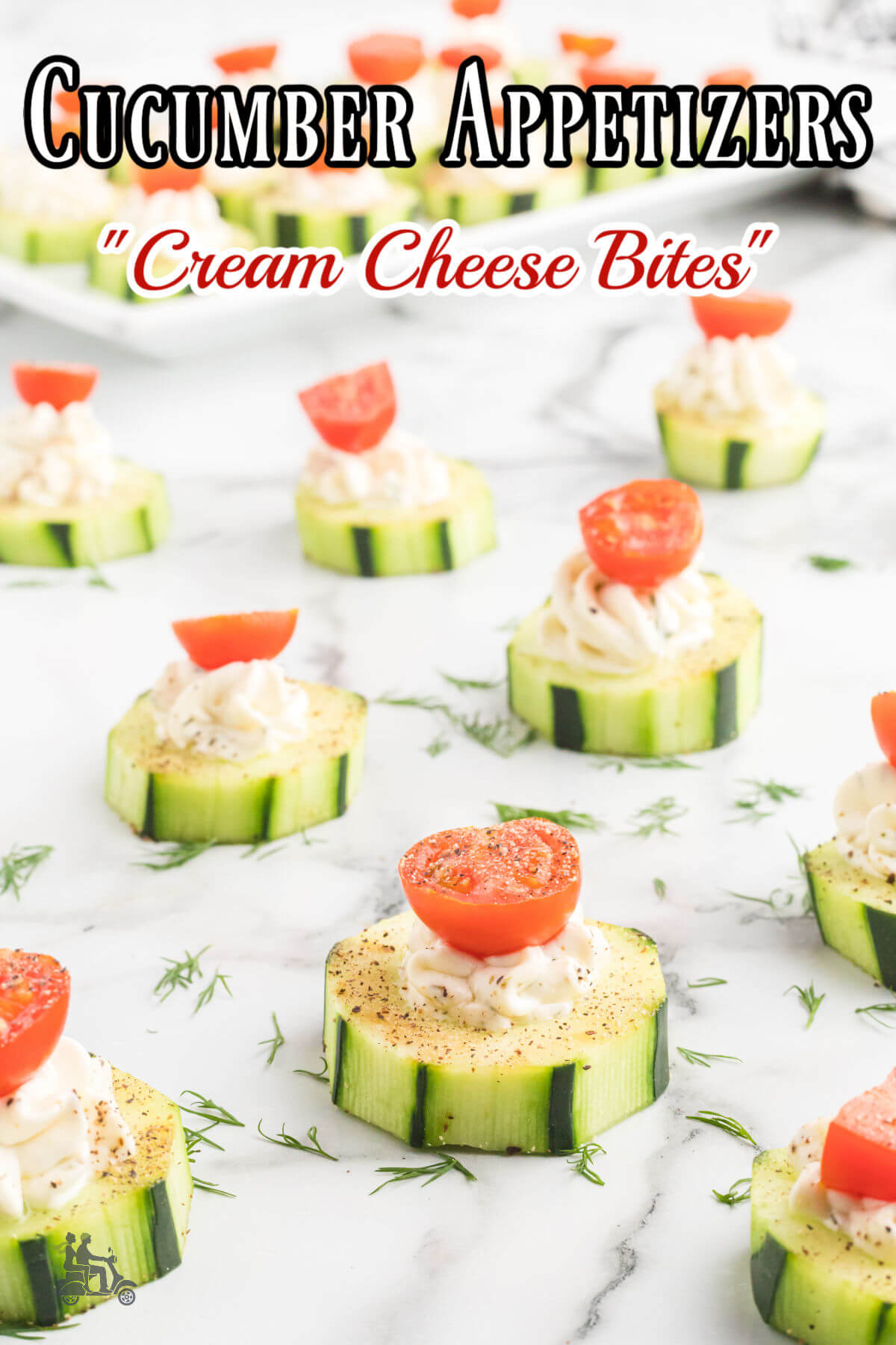 Cucumber appetizer in bites with cream cheese dollop on top. 