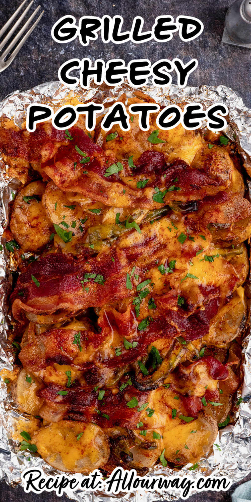 These Grilled Cheesy Potatoes in Foil are easy to make and always a hit with kids and adults alike. Plus, they're perfect for camping! The potatoes are layered with onion, peppers, bacon, cheese, and spicy seasoning. It compliments all of your grilled meats.