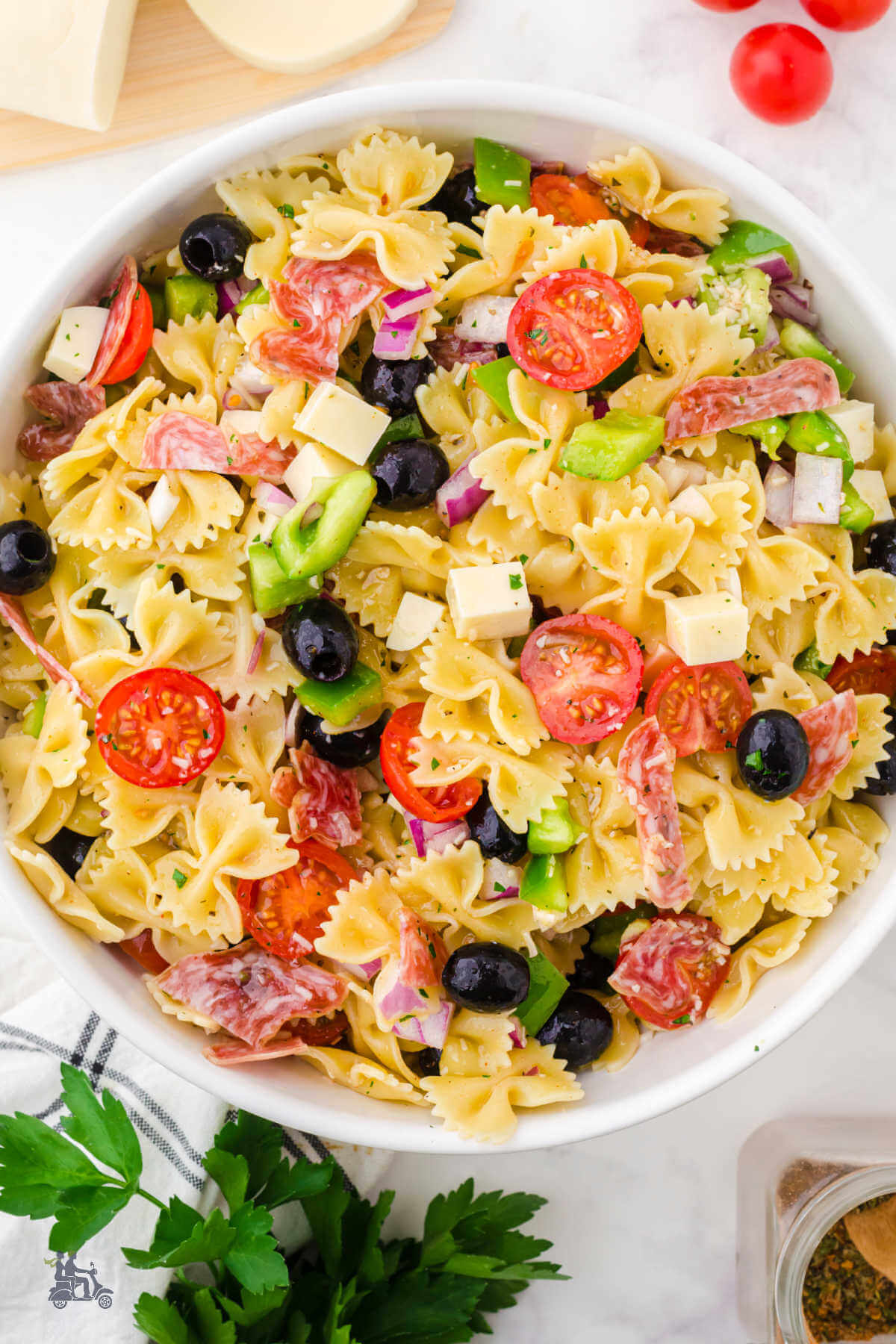 A large bowl of Italian pasta salad.