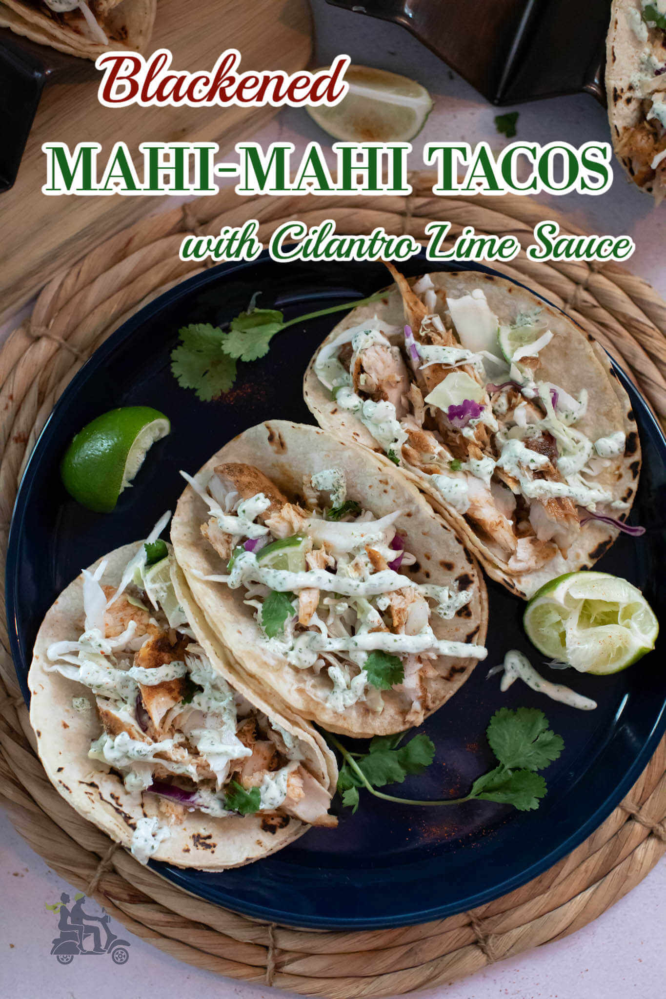 Three Mahi Tacos on a black plate with title overlay. 