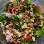 A glass bowl with an antipasto Mediterranean salad.
