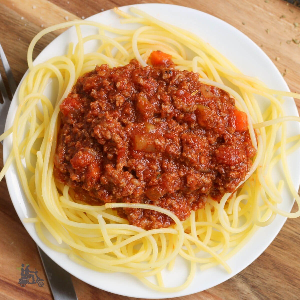 Plate of spaghetti with Italian meat sauce on top.