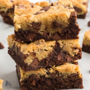 Chocolate chip dough and brownie dough combine to bake into a Brookies recipe for bar cookies.