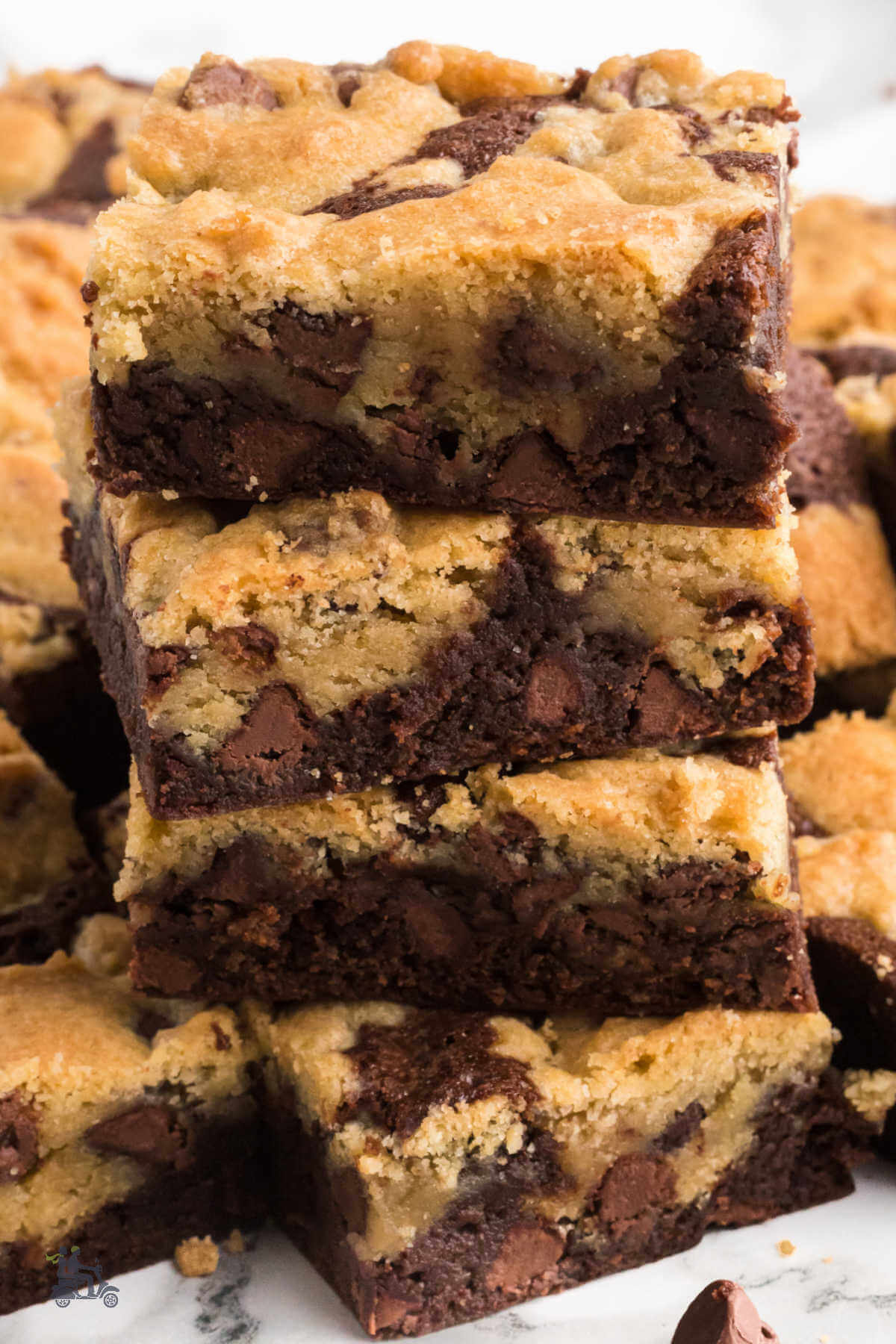 A stack of stacked Brookie bars a combination of brownies and chocolate chip cookies.  