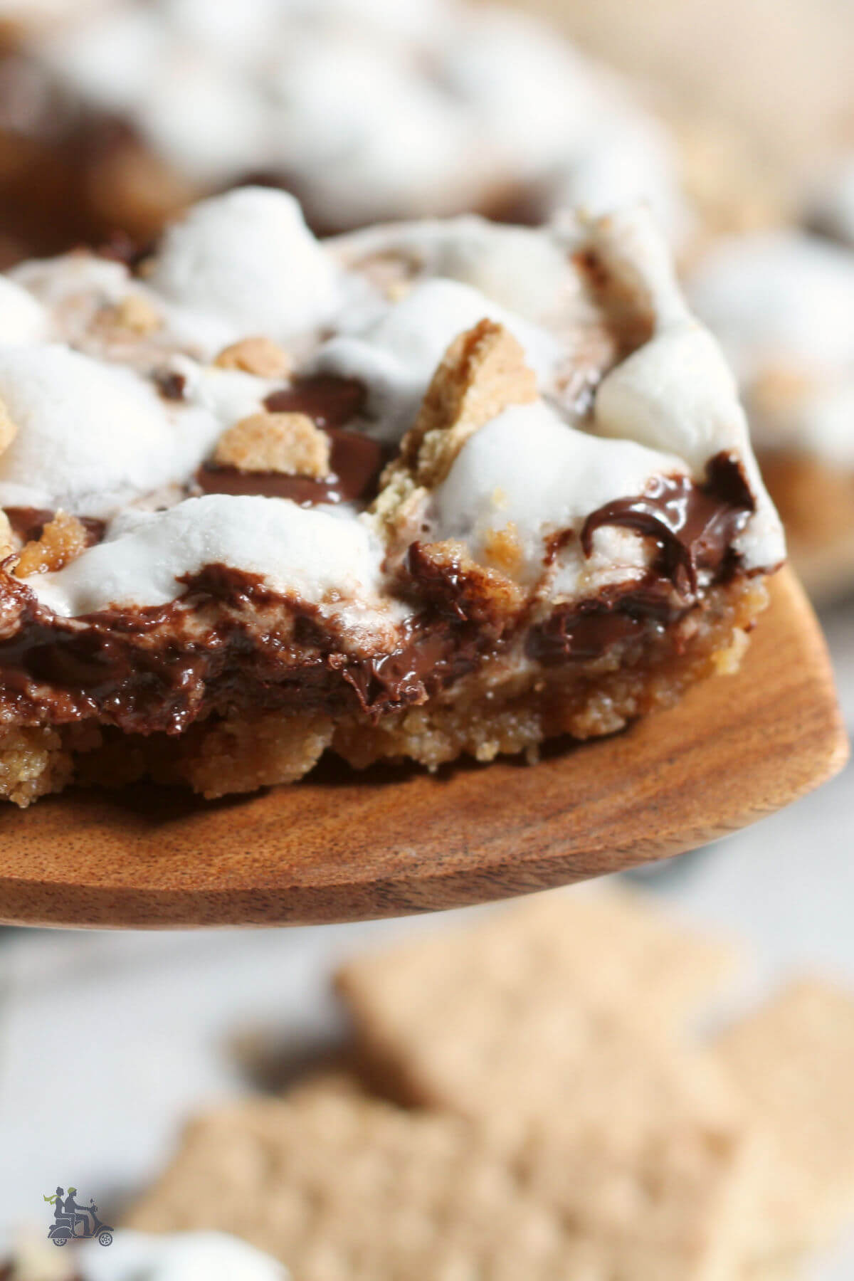 Wooden spatula holding a Smores bar. 