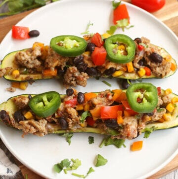 Taco Zucchini boats made into a casserole topped with jalapeño slices.