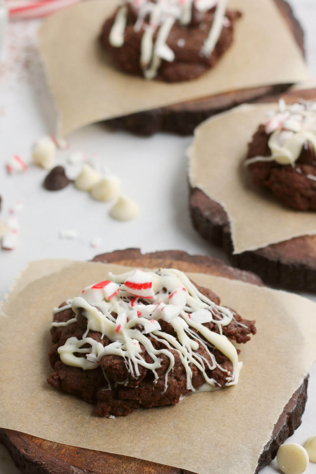 Chocolate Cookies iced with white chocolate and sprinkled with crushed candy canes. 