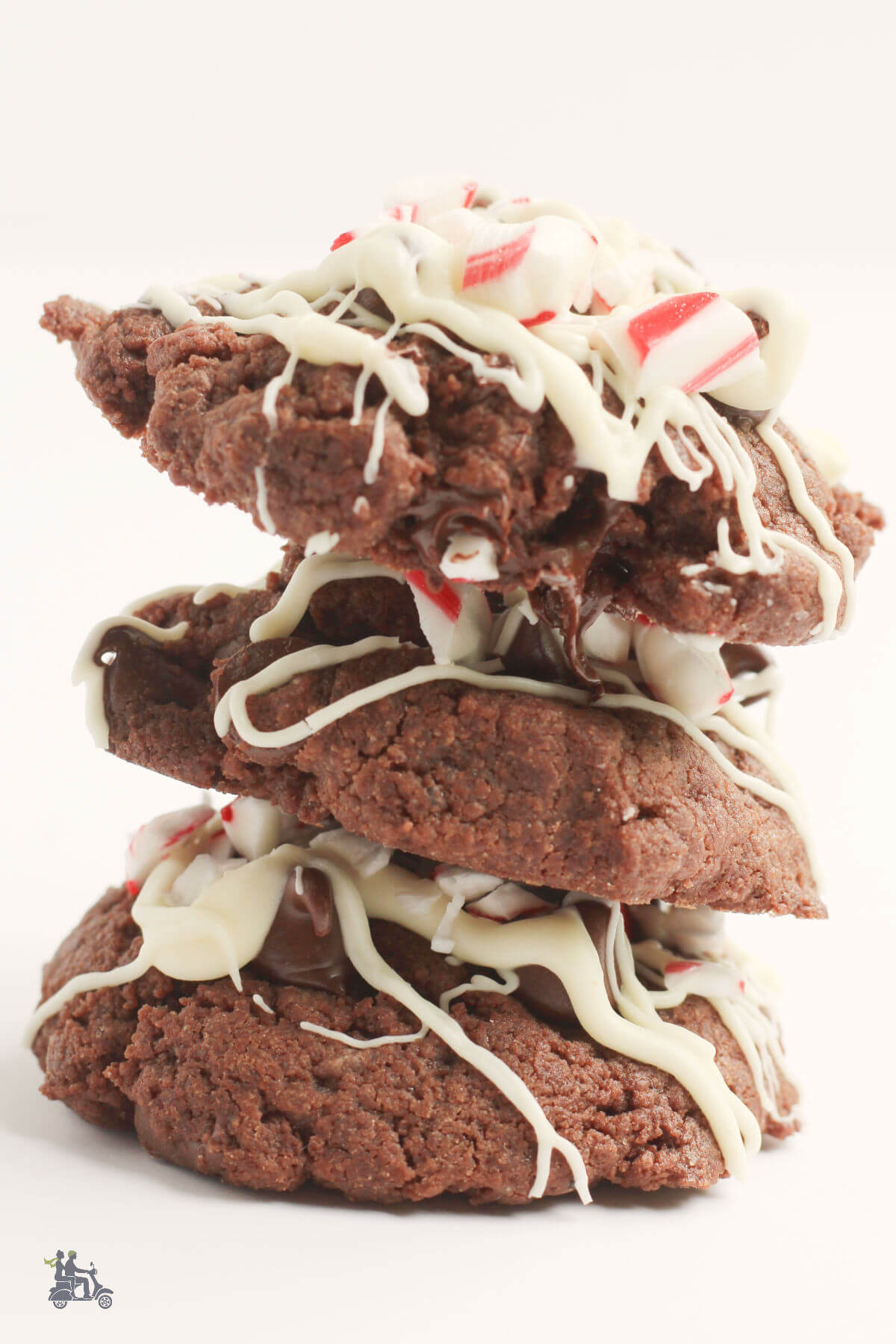 Three Christmas Chocolate Peppermint Cookies stacked on each other. 
