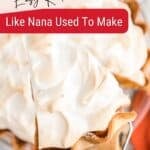 Sweet potato pie with mile high marshmallow meringue topping with a spatula picking up a slice.