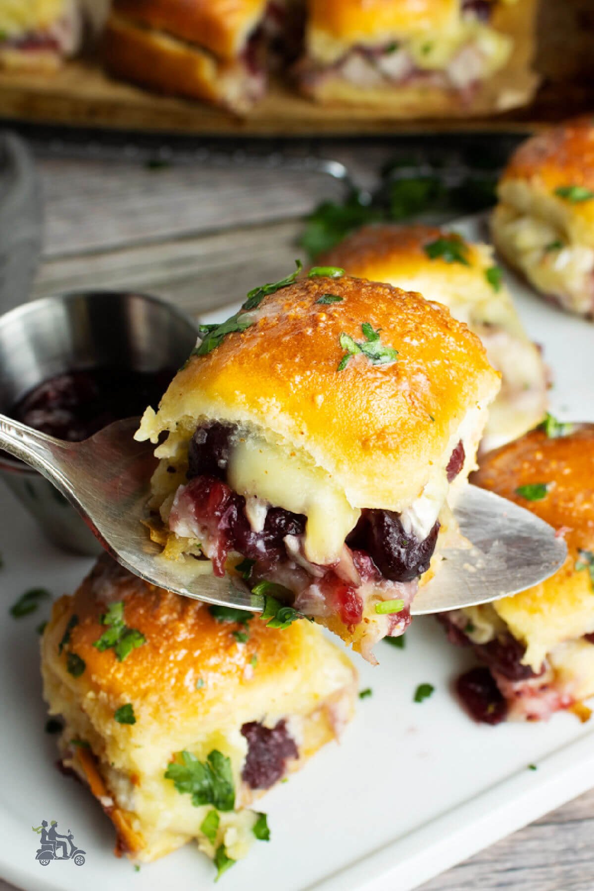 Mini Sandwiches made with leftover Thanksgiving turkey with cranberry sauce and brie cheese. 