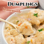 Pinterest image with title overlay of Chicken and Dumplings showing a bowl filled with the soup and a spoon holding a homemade fluffy dumpling.