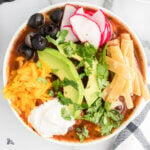 Southwest Chicken Soup With the Garnish Options of radishes, black olives, avocado, tortilla strips, sour cream, cheddar cheese.