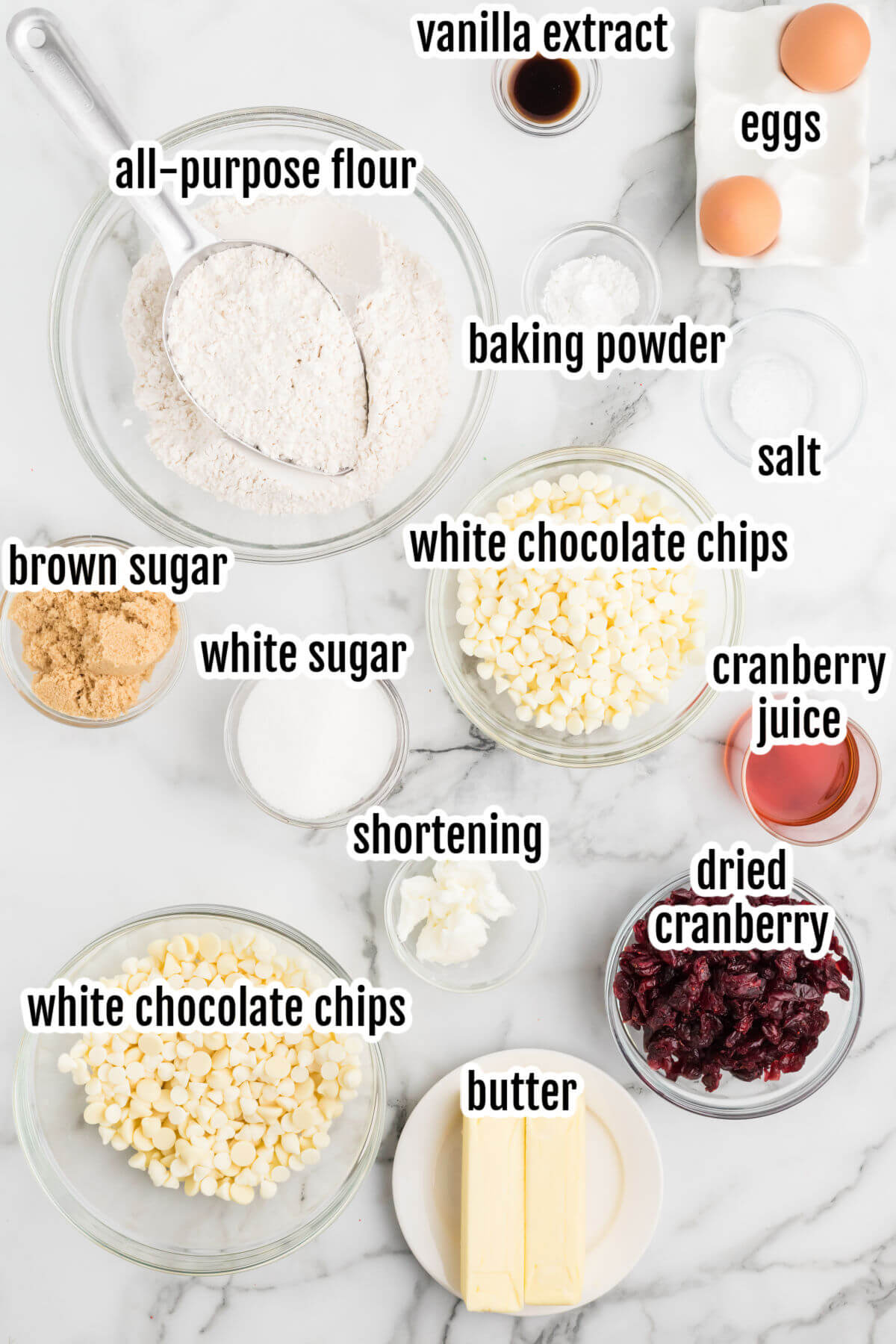 Image of ingredients needed to make Cranberry cookies with white chocolate chips and white chocolate drizzle on top. 