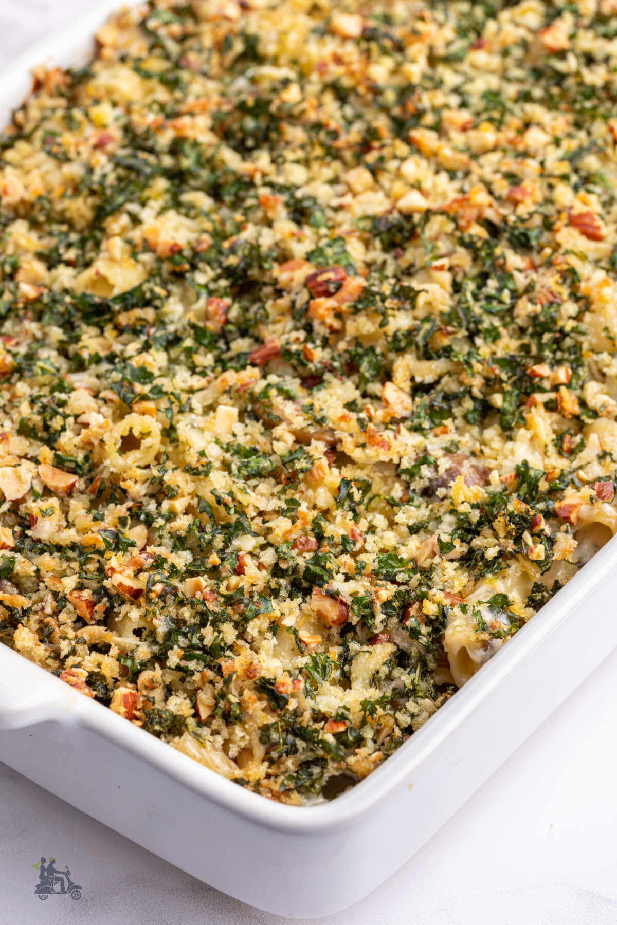 An image of the baked rigatoni pasta with mushroom topped with a kale gremolata. 