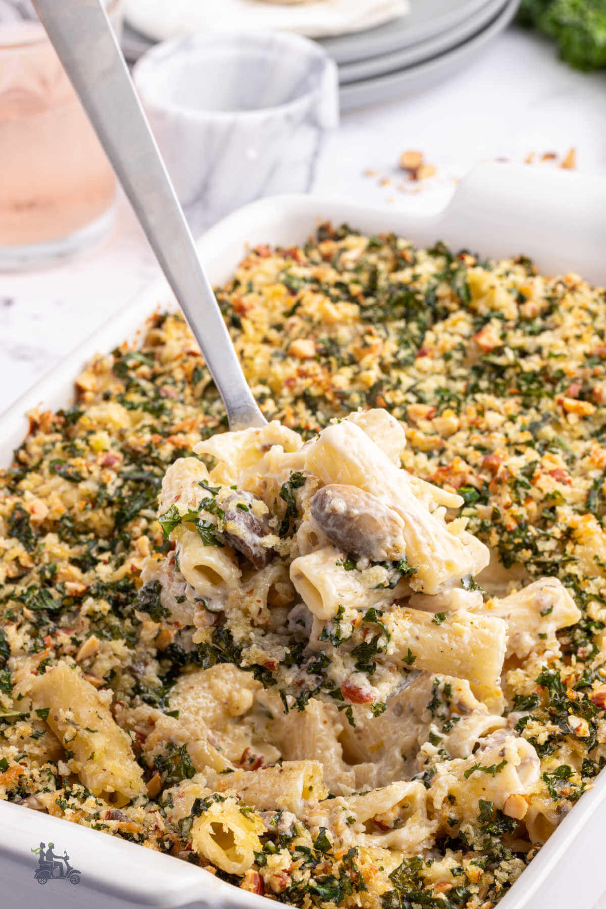 A spoonful of the mushroom pasta casserole recipe taken from the baking dish. 