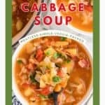 A bowl of cabbage vegetable soup brimming with fresh chunky veggies.