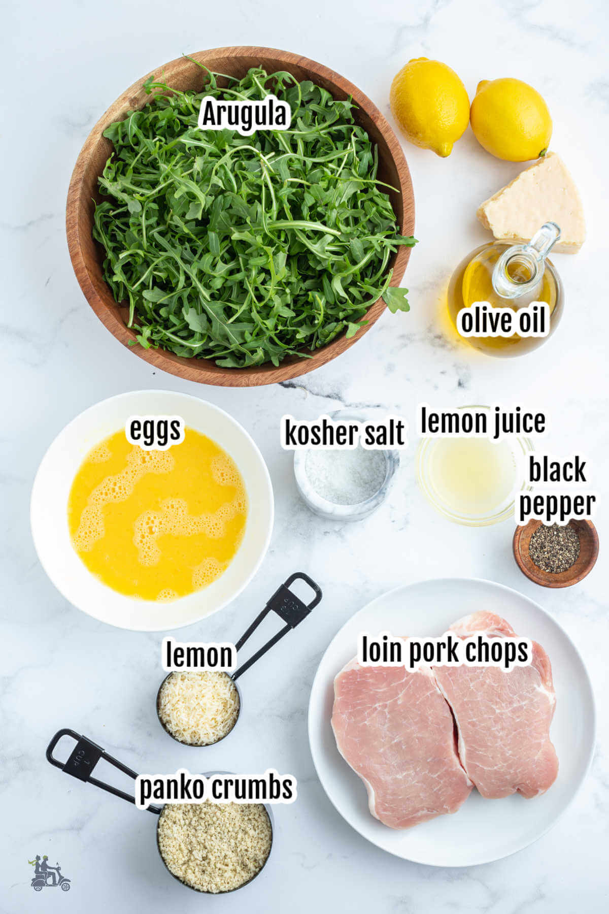 Image of ingredients needed to make the Pork Chops Milanese with Arugula Salad tossed in lemon vinaigrette. 
