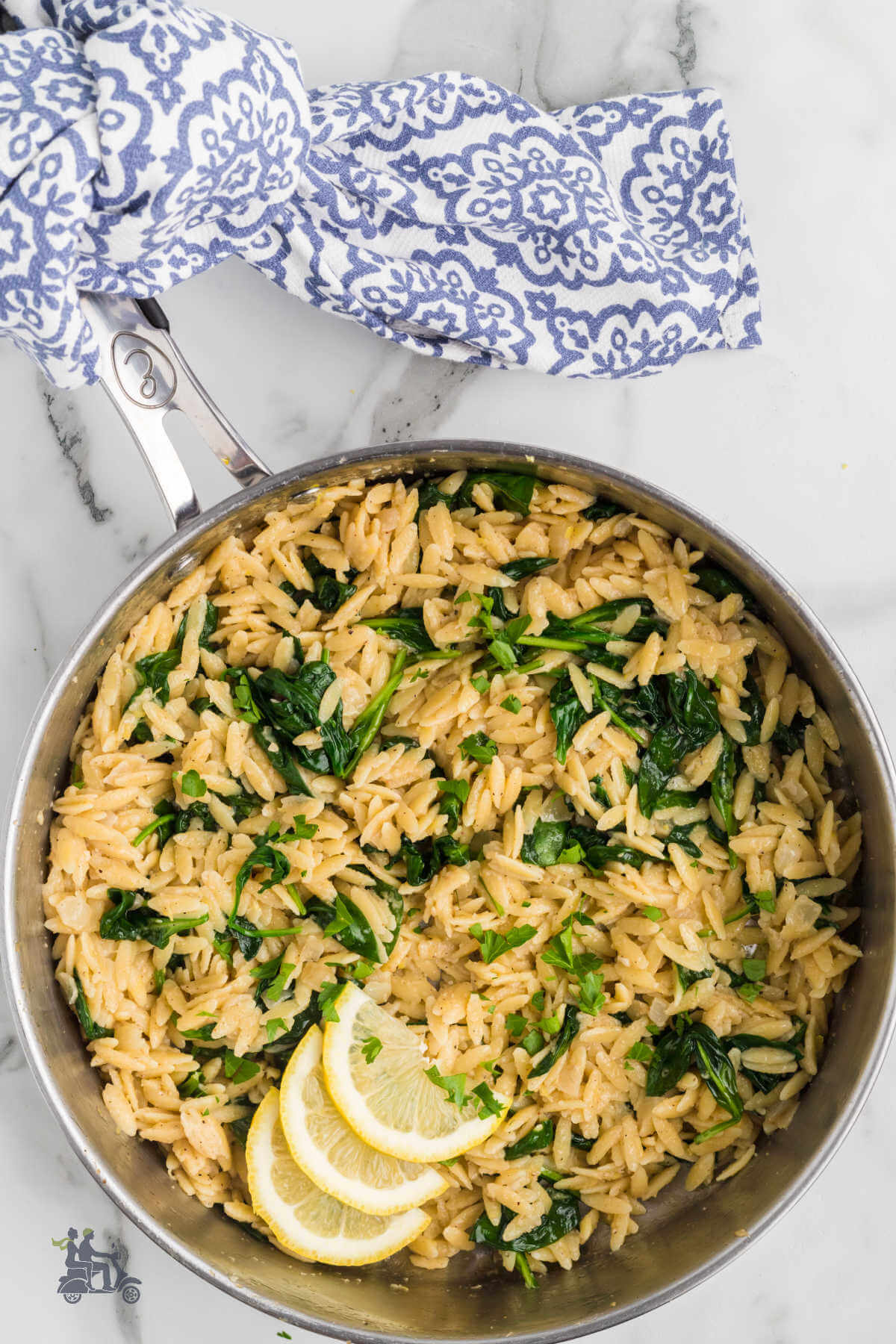 The rice shaped pasta orzo made into a risotto like dish with spinach and lemon flavoring. 