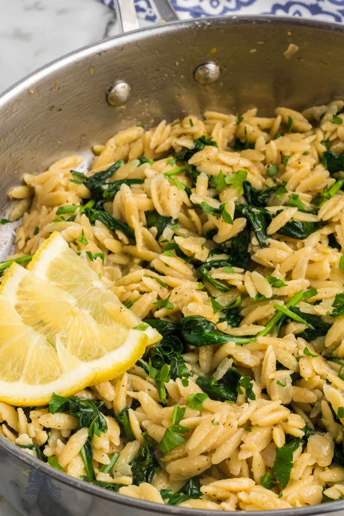 Close up of the Lemon Orzo with Spinach recipe in a skillet. 