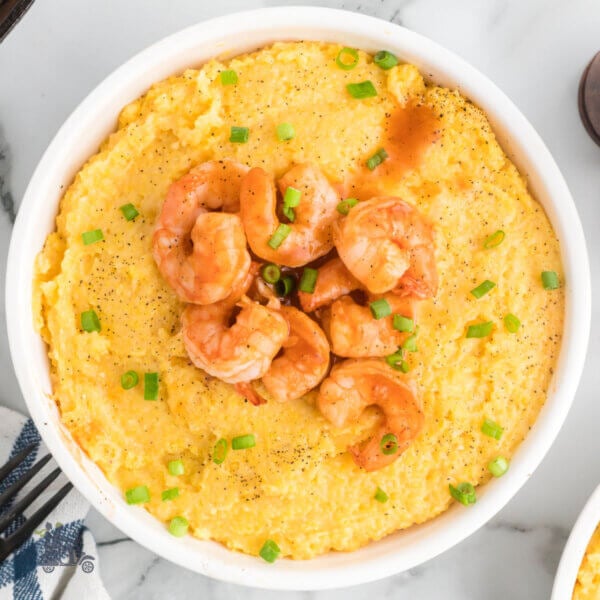 Cheesy Corn Grits topped with BBQd shrimp.