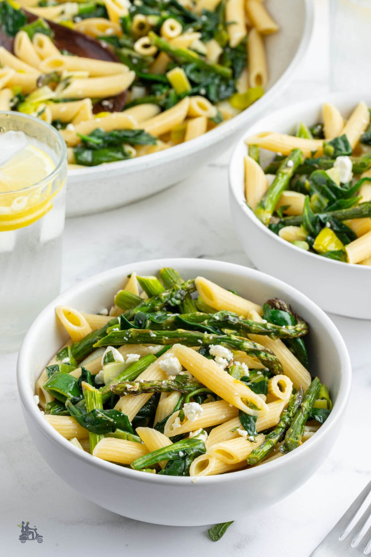 Penne pasta with fresh springtime greens combine to make a Pasta Primavera recipe dressed with a lemony vinaigrette. 