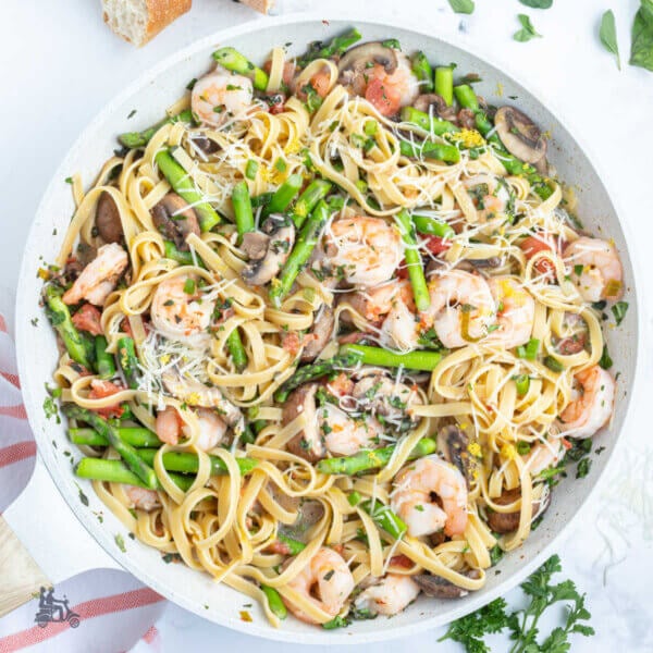 Shrimp Pasta Primavera mixed with spring vegetables and sautéed with pasta.