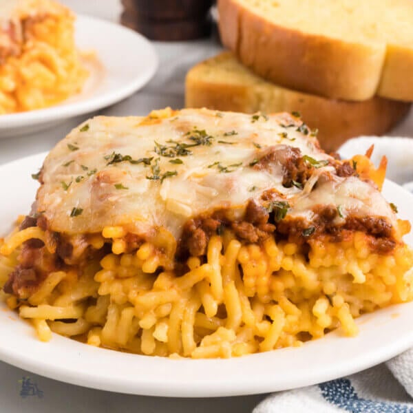 Tik Tok popular Million Dollar Spaghetti combining pasta with a ragù sauce and an Alfredo sauce in pasta layers.