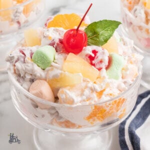 Creamy Ambrosia Salad in a glass goblet and is also called 5 cup salad.