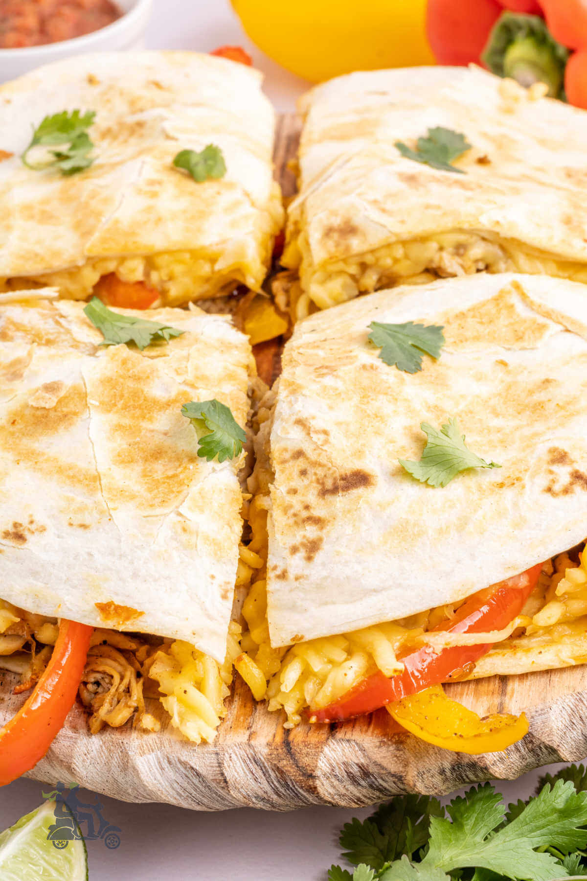 A side view close up of the chicken quesadilla made with colored bell peppers. 