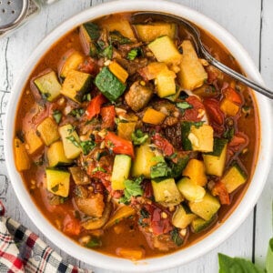 A bowl filled with Ciambotta an Italian vegetable stew.