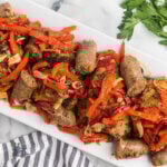 Chicken and Sausage cooked with red peppers in a spicy sauce to make the Italian Chicken Scarpariello.