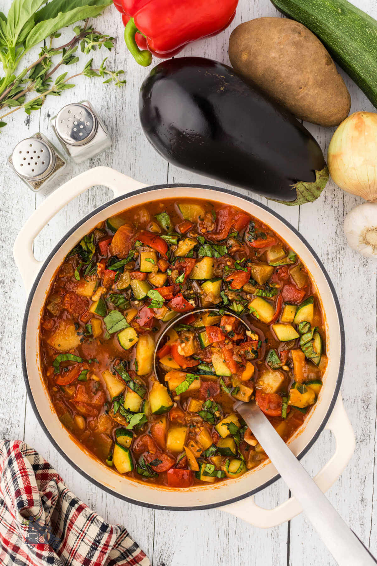 Dutch oven filled with the hearty Italian stew Ciambotta. 