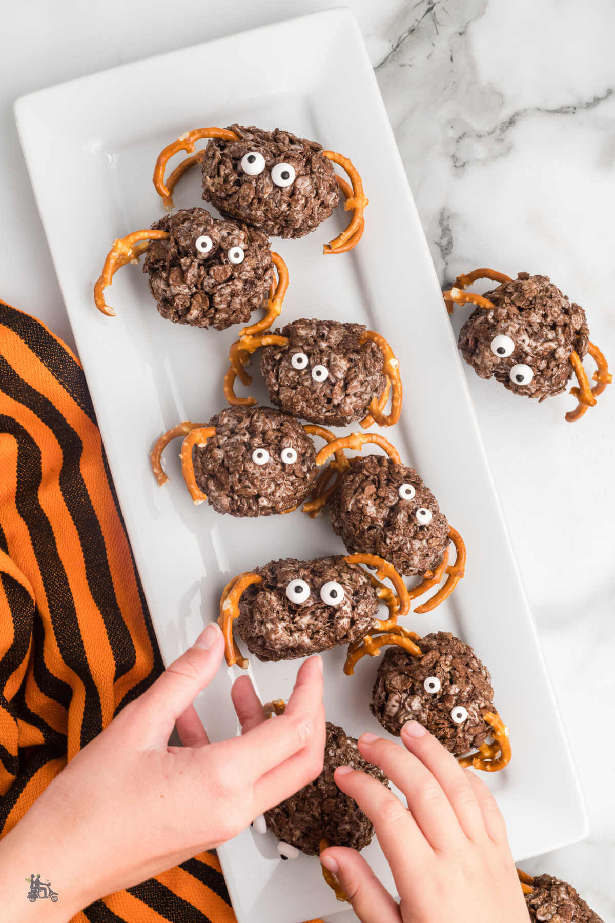 Cocoa Krispie Halloween Spiders is a Fun Holiday Activity to make with children. 