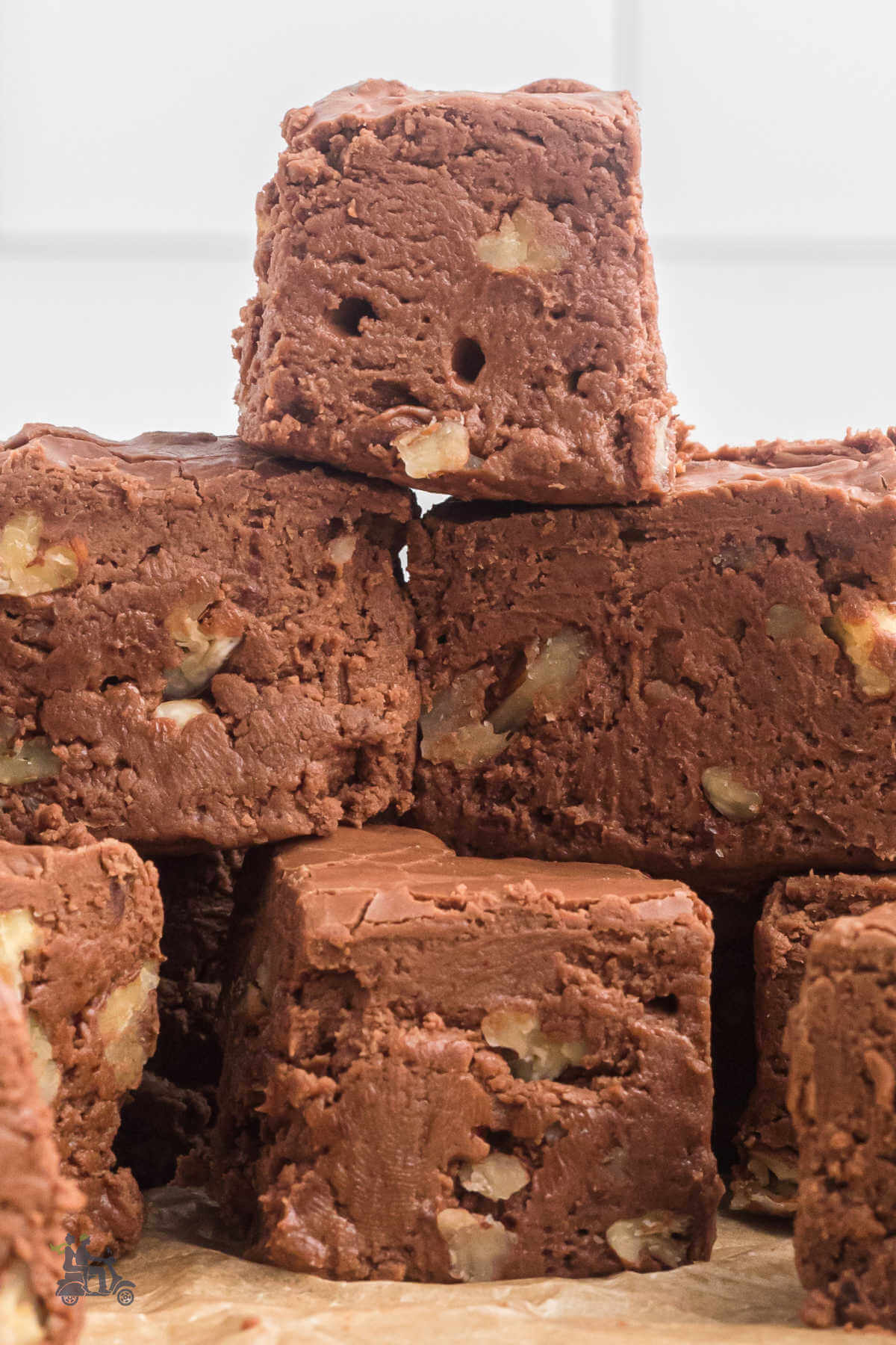 A pyramid of creamy chocolate fudge with pecans. 