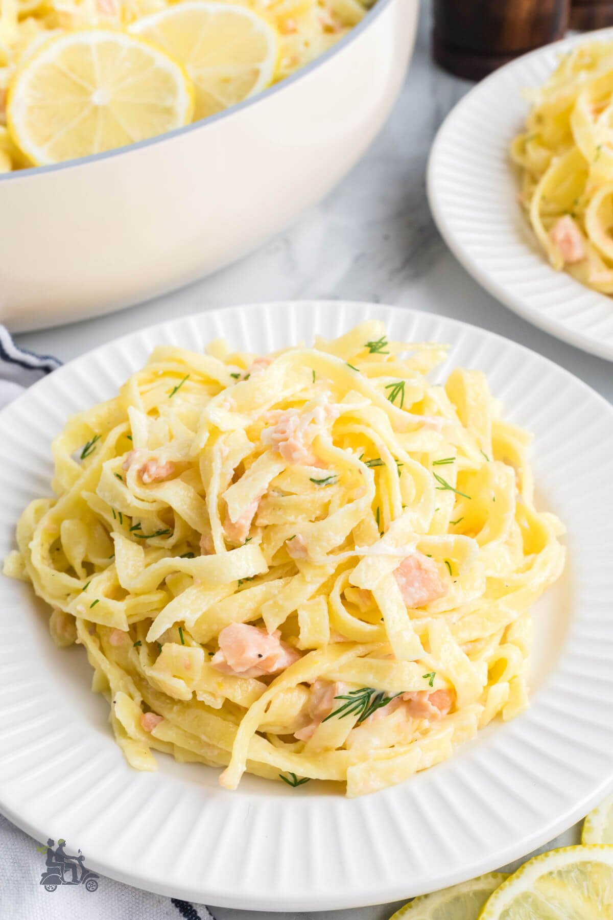 Thin ribbons of egg pasta mixed with smoked salmon in a cream sauce and garnished with fresh dill. 