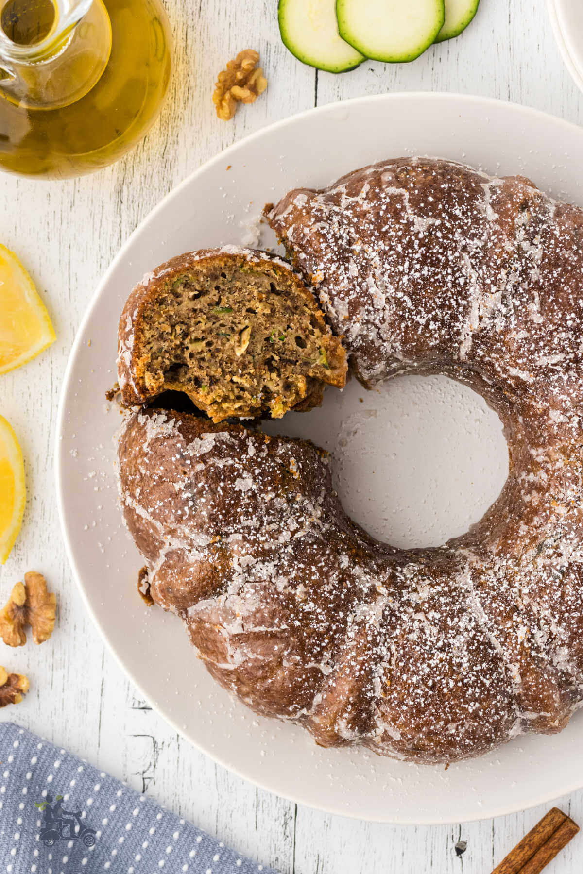 Bundt cake made with olive oil and zucchini and topped with a lemon glaze. 